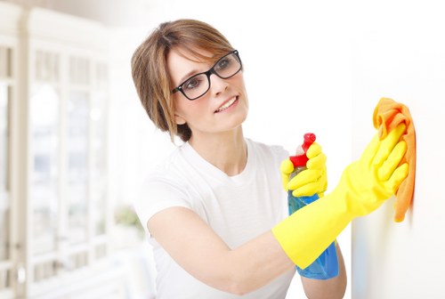 Cleaner dusting and sanitizing surfaces as part of one off cleaning
