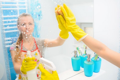 Bedroom dusting and tidying as part of domestic cleaning